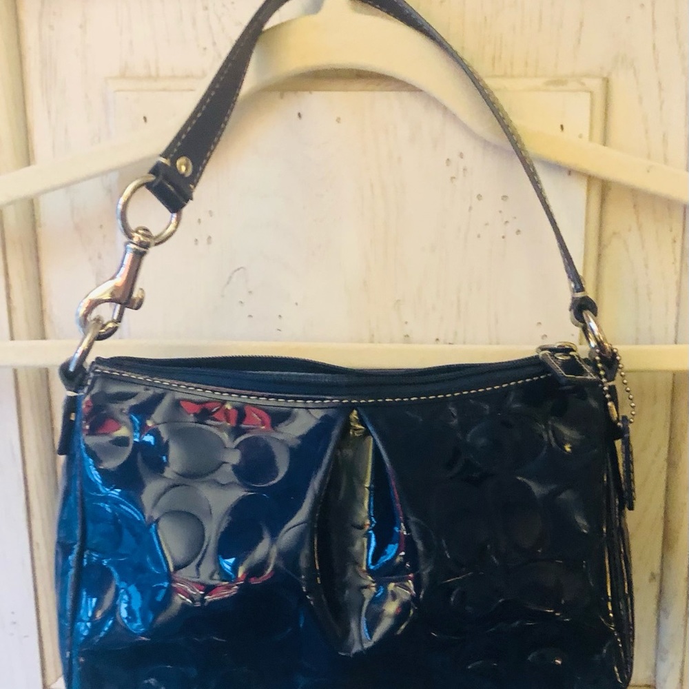 Coach “C” printed navy patent leather small purse; excellent condition.